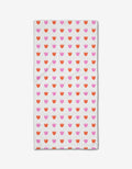 The Addison bar towel by Amy MacCready is a rectangular white towel featuring rows of pink and orange tulip-like shapes, crafted from innovative Geoweave fabric.