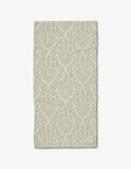 The Amberlin towel by Amy MacCready is a rectangular beige bar towel crafted from recycled materials, featuring symmetrical green leafy branches and vines that stand out against the light background.