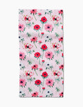 The Anemone Garden Flowers Bar Towel by Linda Fox features a pale pink background with a repeating pattern of red, pink, and white flowers with green stems and leaves, evenly spread across recycled fabric.