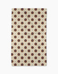 A beige Geometry Artisan Floral Tea Towel with a repeating pattern of red and blue circular floral designs and small black accents, displayed flat against a white background.