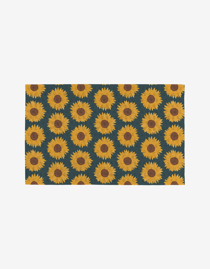 Autumn Florals by Rebecca Bobko: a rectangular mat featuring bright yellow sunflowers with brown centers on a dark green background—an eco-friendly, reusable alternative to disposable paper towels.