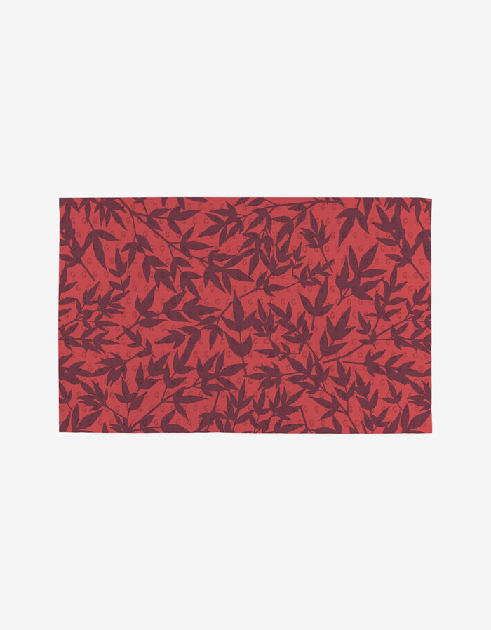 Autumn Florals by Rebecca Bobko features a rectangular fabric with red and maroon leaves on a light background—an eco-friendly alternative to reusable paper towels. Leaves overlap in different orientations for a unique look.