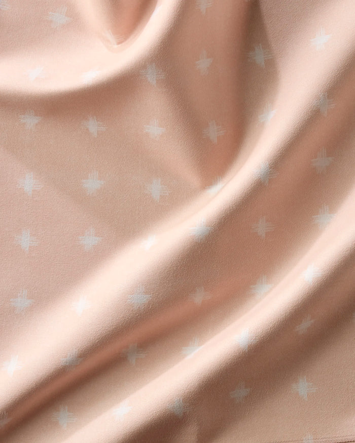 Aveline by Amy MacCready features soft, light peach fabric with white cross patterns and gentle folds—ideal for creating elegant, reusable cloth napkins in your Dinner Napkin Set.