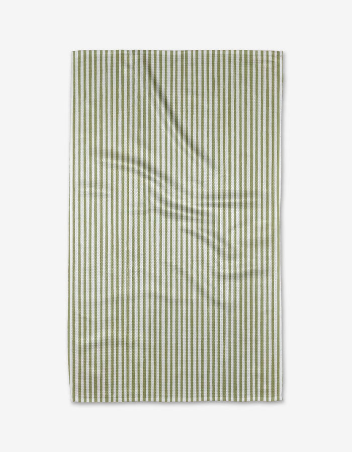 The Kailee Wright Avocado towel, featuring green and white stripes and made from ultra-absorbent Geoweave fabric, is laid flat on a white background with slight surface wrinkles.