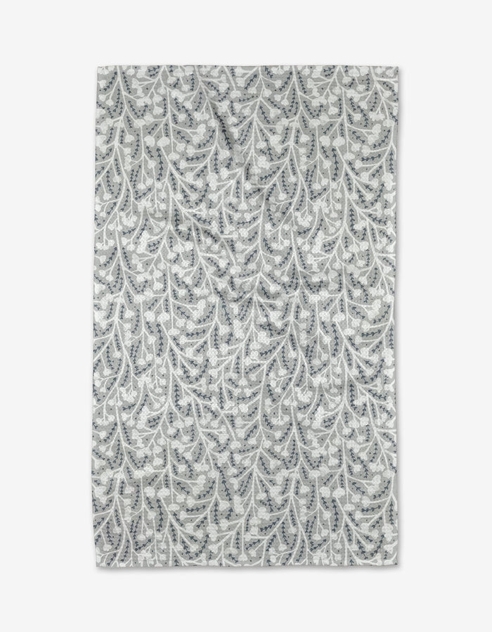 The Babys Breath Geoweave fabric by Katie OShea features a white background with gray and blue leaf and vine patterns, laid flat to showcase its intricate botanical design and ultra-absorbent, eco-friendly qualities.