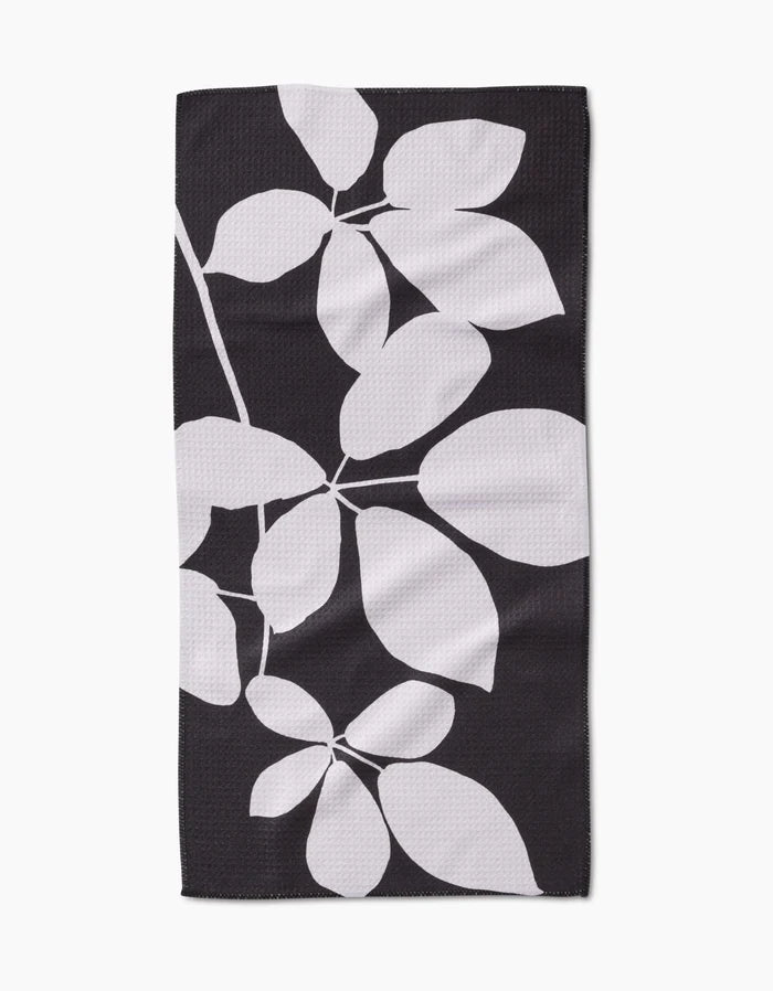 PrintedPlant’s Blackberry is a rectangular black bar towel with a striking white botanical leaf design, crafted from premium Geoweave fabric.
