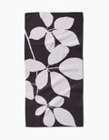 PrintedPlant’s Blackberry is a rectangular black bar towel with a striking white botanical leaf design, crafted from premium Geoweave fabric.