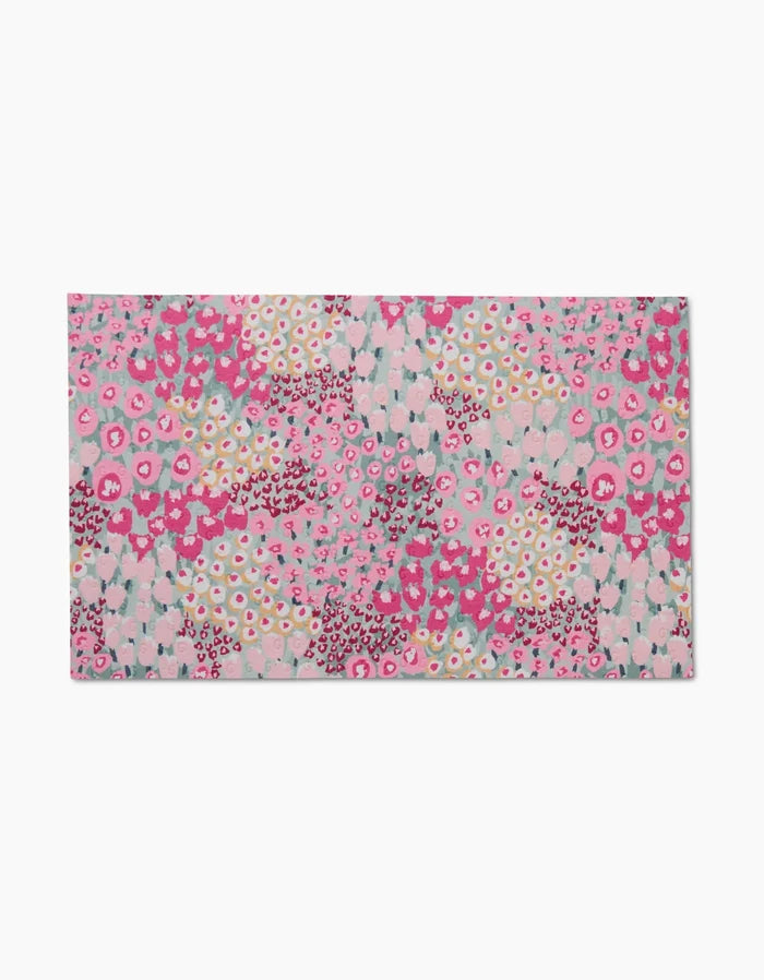 The Bloomed For Spring rectangular mat by Hufton Studio features an abstract floral pattern in pink, white, burgundy, and teal on a light background—crafted from post-consumer recycled materials for eco-friendliness.