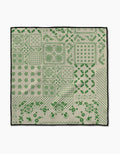 The Blossoming Bandanna Green by Geometry is a square beige cloth made from ultra-absorbent Geoweave™ fabric, featuring green floral, geometric, and dotted patterns in blocks with a black border. Ideal as a pet Paw Towel.