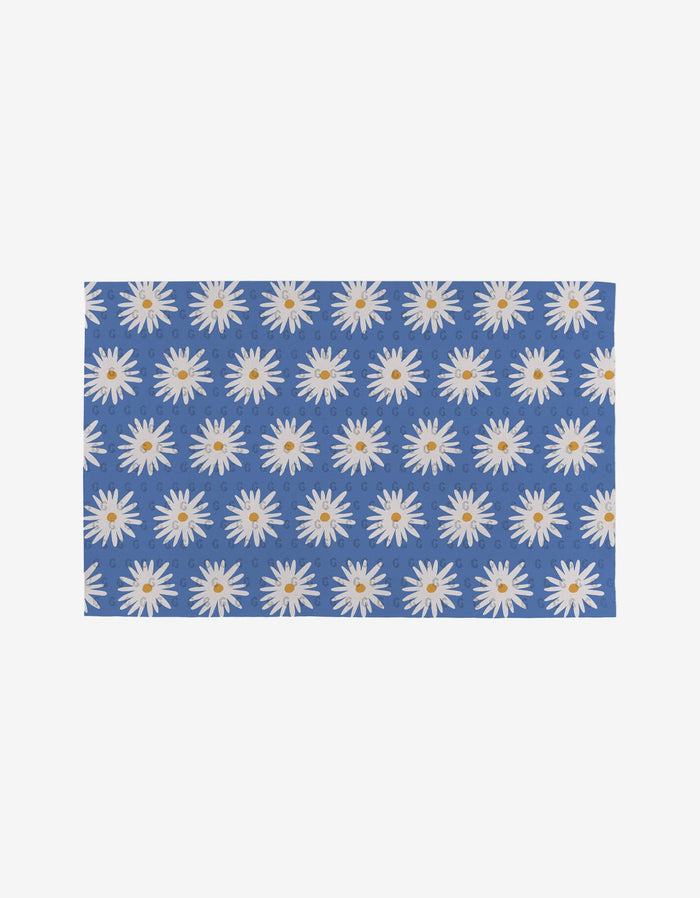 Megan Roy’s Blue Daisies is a rectangular blue mat with evenly spaced white daisies featuring yellow centers—a reusable, eco-friendly alternative to Not Paper Towels.