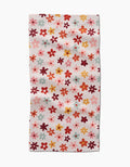 The Bright Field Of Fall Daisies by Sara Mari is a rectangular, ultra-absorbent towel adorned with small daisies in red, orange, pink, and yellow on a white background—ideal for brightening up any space.