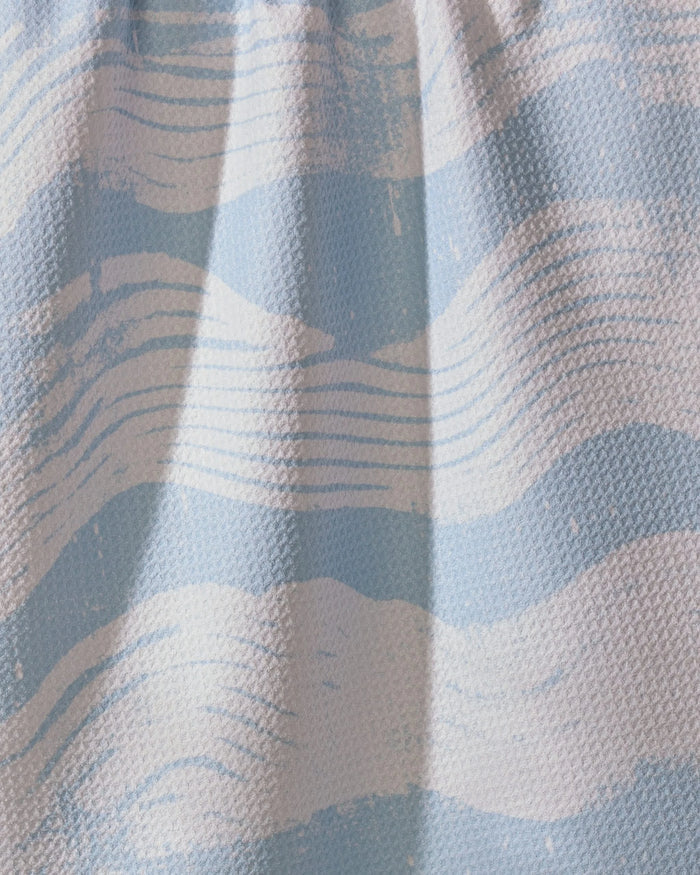 A close-up of Geometry’s Brushline Lightblue shows wavy, brushstroke-like stripes in light blue and white—ideal for an ultra-absorbent or recycled kitchen towel.