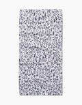 The Bunny Rabbit Garden by Charlie Rowan Designs is a white rectangular fabric with a close black line art pattern of rabbits, flowers, and leaves—ideal as a quick-drying towel for your kitchen or bar.