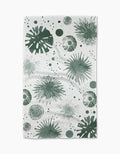 Geometrys Bursting Skies Green Tea Towel showcases starbursts, circles, and dots in green on ultra-absorbent Geoweave fabric, blending modern style with everyday function.