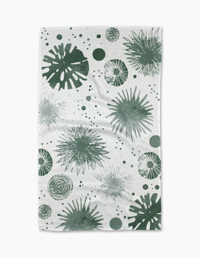 Geometrys Bursting Skies Green Tea Towel showcases starbursts, circles, and dots in green on ultra-absorbent Geoweave fabric, blending modern style with everyday function.