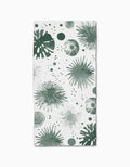 The Geometry Bursting Skies Green is a white rectangular bar towel, made from recycled materials, featuring playful green abstract sea urchins and dotted shapes for a marine-inspired look.