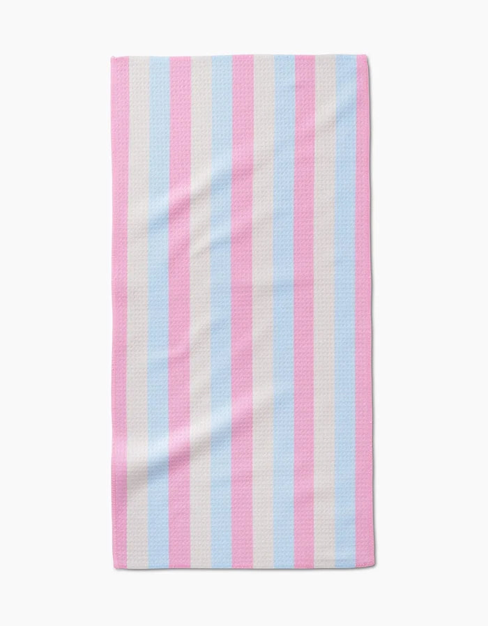 The Candy Pastels Bar Towel by Amy Droubay features vertical stripes in light blue, light pink, and white, inspired by the transgender pride flag, and is made from ultra-absorbent Geoweave fabric. Shown on a white background.