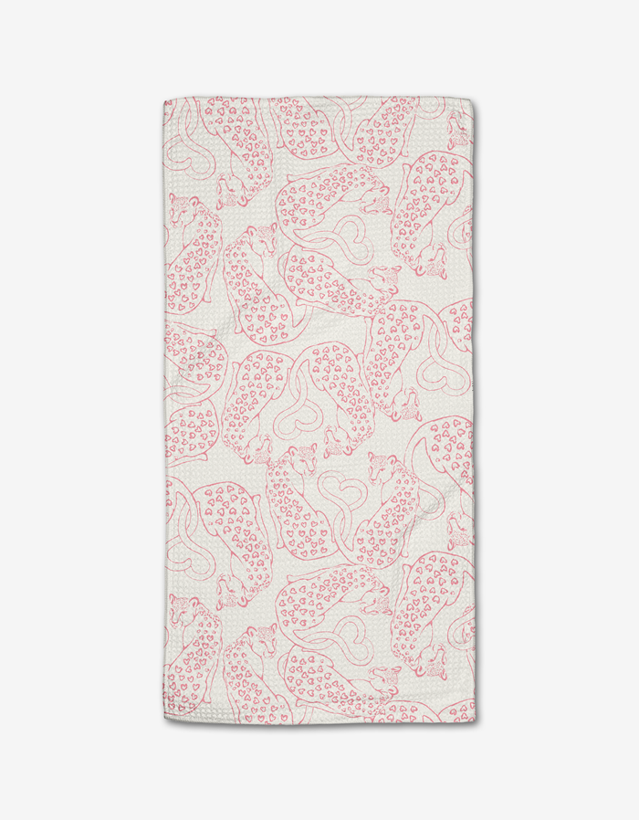 The Cat Lover bar towel by Hufton Studio is a white rectangle made from Geoweave fabric, featuring a repeating pattern of red, stylized cheetahs in various poses with minimalistic outlines.