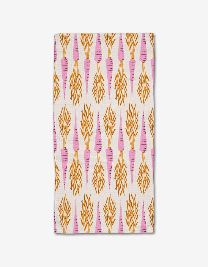 The Chantenay Bar Towel by Amy MacCready is made of ultra-absorbent Geoweave fabric and features a repeating pink carrot pattern with orange leafy tops on a white background.