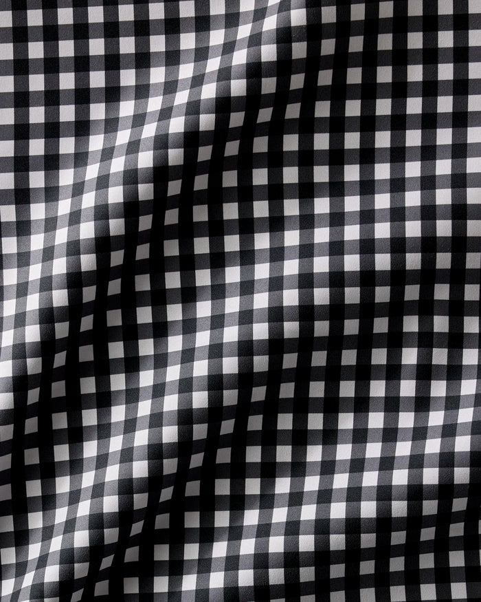 Geometry’s Charcoal Gingham features a classic black and white checkered design with soft folds and shadows—ideal for absorbent or recycled dinner napkins.