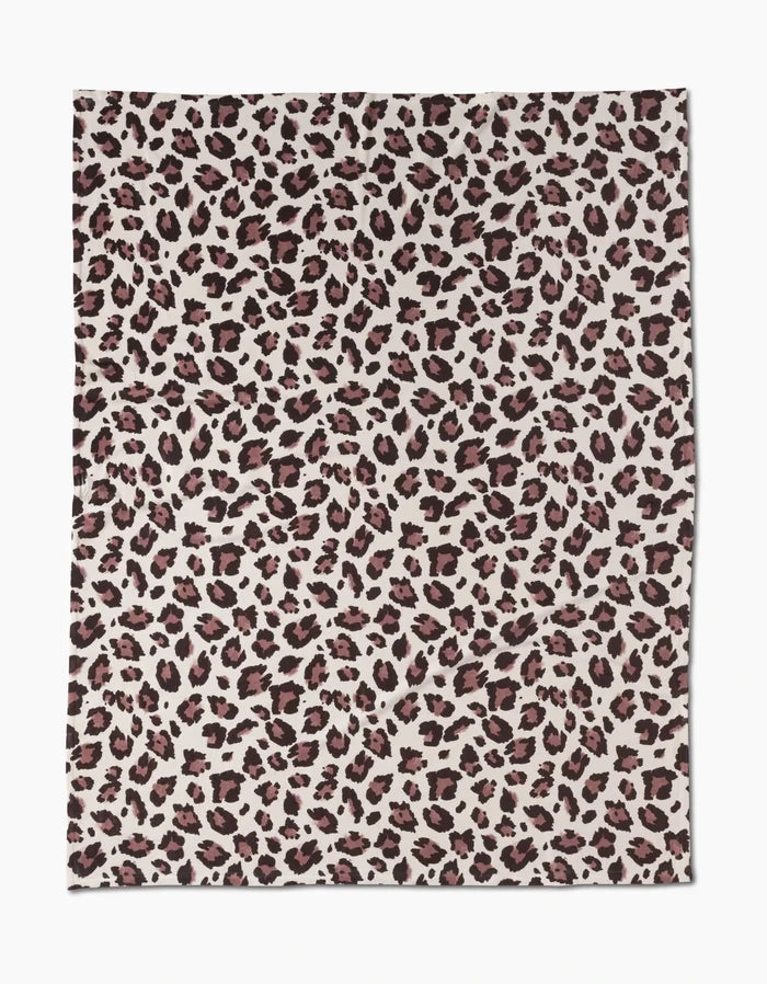 The Geometry Cheetah is a rectangular fabric with a leopard print featuring dark brown and black spots on light beige, offering silky softness for cozy comfort.