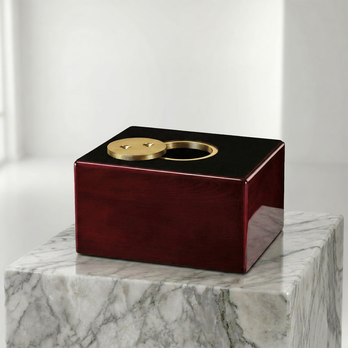 Modern decorative object with gold accents on a marble surface