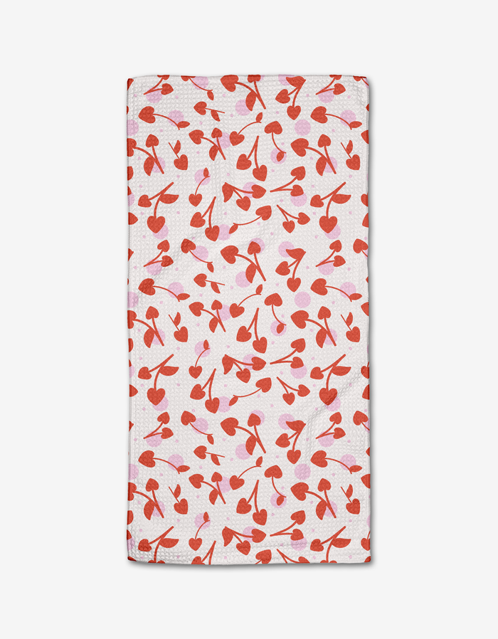 Cherry Love by Charlie Rowan Designs is a white, ultra-absorbent kitchen towel with playful red and pink cherries, made from premium Geoweave fabric.