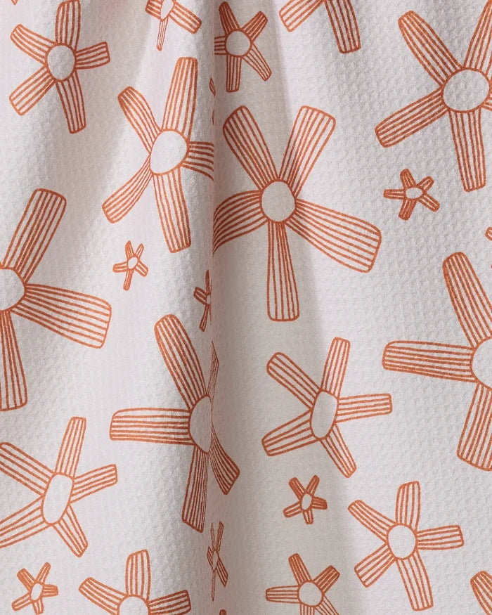 The Chunky Striped Flower tea towel by Coit Creative is made from quick-drying, recycled material and features a white texture with large and small orange five-petaled flowers, each with lined details spaced evenly across the surface.