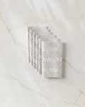 A bag of Chutes Coffee by Studio Jeannot sits on a light marble surface, offering a premium and sustainable choice for eco-conscious coffee lovers.