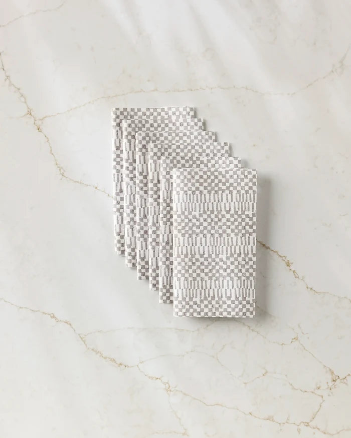 A bag of Chutes Coffee by Studio Jeannot sits on a light marble surface, offering a premium and sustainable choice for eco-conscious coffee lovers.