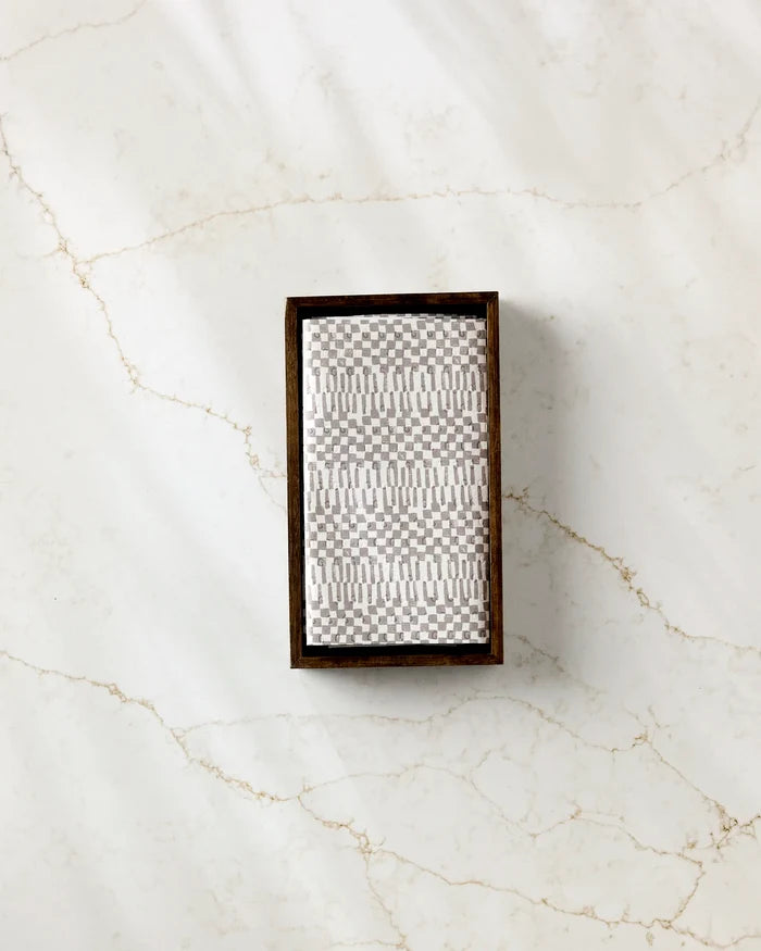 A bag of Chutes Coffee by Studio Jeannot sits on a light, veined marble surface, providing an elegant touch to your kitchen décor.