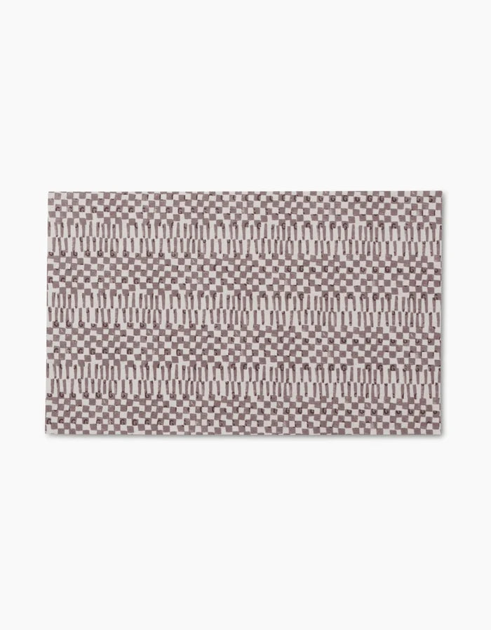 Chutes Coffee by Studio Jeannot is a rectangular rug with a geometric brown and beige pattern of repeating rectangles and ovals on white, crafted from recycled materials for an eco-friendly touch.