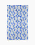 The Geometry Coastal Catch Tea Towel, made from Geoweave fabric, features a repeating blue fish pattern and is shown flat against a plain white background.