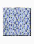 The Geometry Coastal Catch mat features a light gray background with blue fish in various directions, a thin black border, and is crafted from ultra-absorbent Geoweave fabric.
