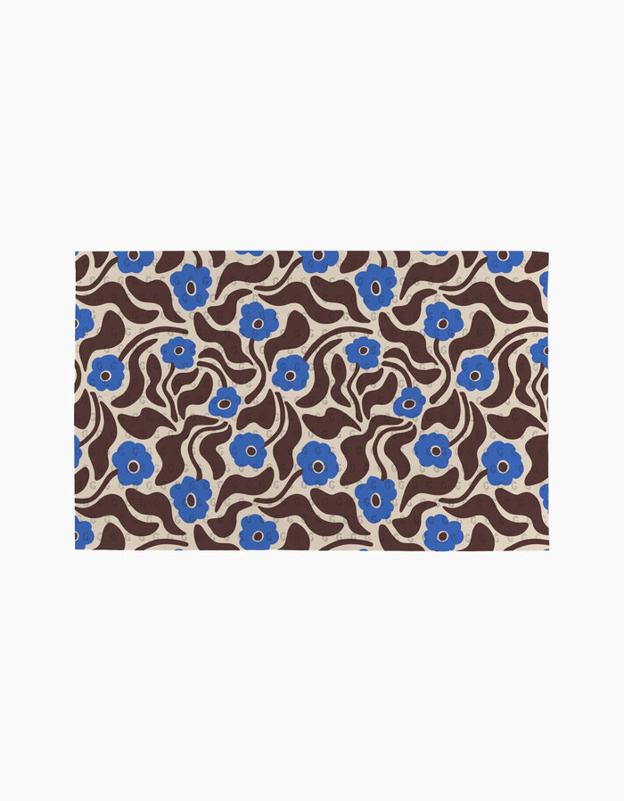 Coffee Reverie by Gerdadzy is a rectangular rug featuring wavy brown lines and blue flowers with beige centers on a beige background, ideal for enhancing eco-friendly kitchens or pairing with sustainable towels.