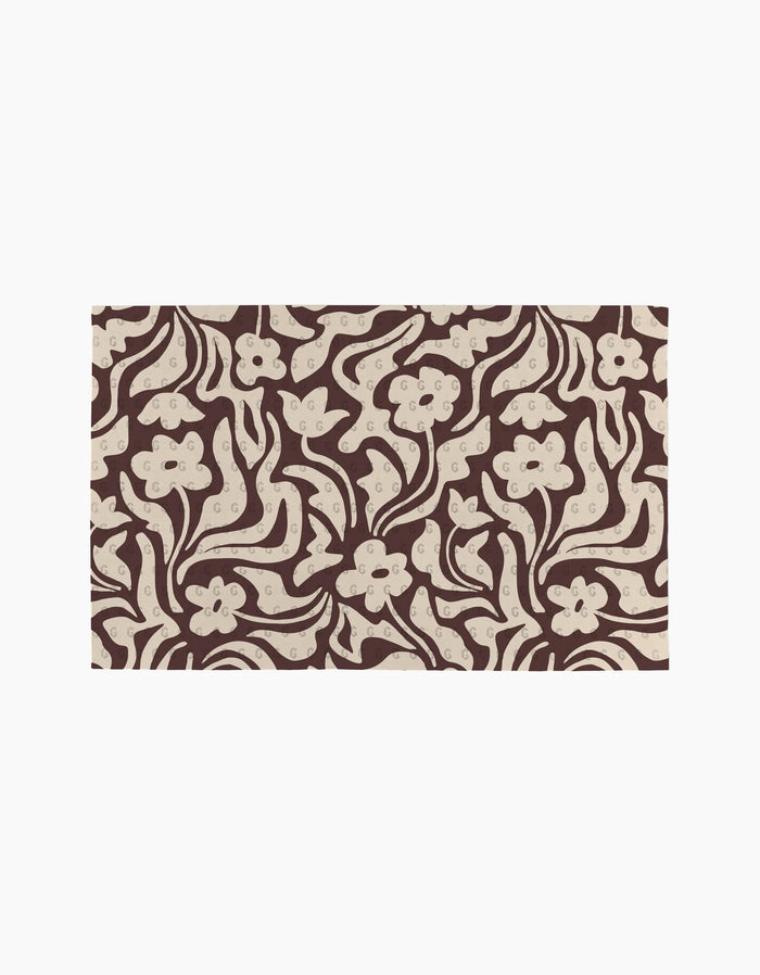 Coffee Reverie by Gerdadzy features an abstract floral pattern with cream flowers and swirls on a brown backdrop—ideal for stylish, eco-friendly kitchen towels or as a recycled paper towel alternative.