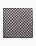 The Geometry Cool Pup dog towel in black and white checkered pattern lays flat, showing a wrinkled, highly absorbent surface with repeating squares.