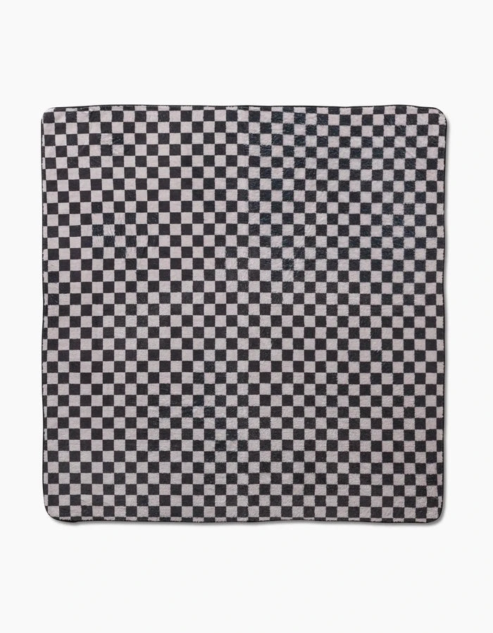 The Cool Pup by Geometry is a square cloth made from recycled materials, featuring a black and white checkered pattern with evenly spaced small squares, displayed flat on a white background.
