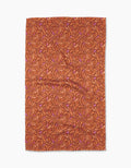 The Geometry Coral Swirls Tea Towel features an abstract pattern of swirling, interlocking shapes in dark orange and pink on white, crafted from Geoweave™ fabric.
