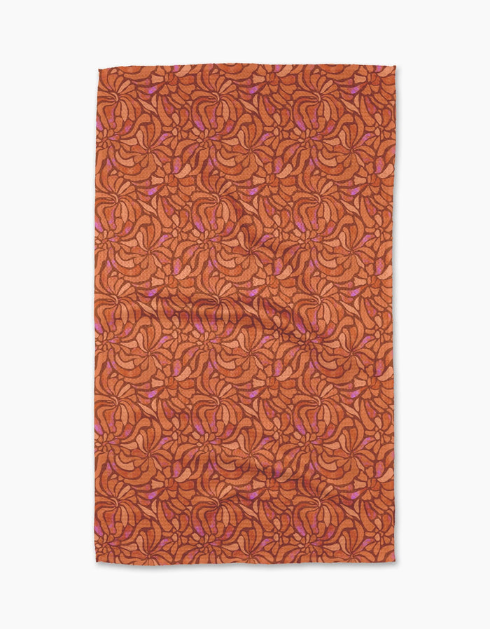 The Geometry Coral Swirls Tea Towel features an abstract pattern of swirling, interlocking shapes in dark orange and pink on white, crafted from Geoweave™ fabric.