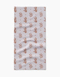 The Country Road by Charlie Rowan Designs is a rectangular Geoweave cloth with small rust floral motifs and plus signs on a light, textured background. Slight wrinkles add to the versatility of this stylish kitchen accessory.