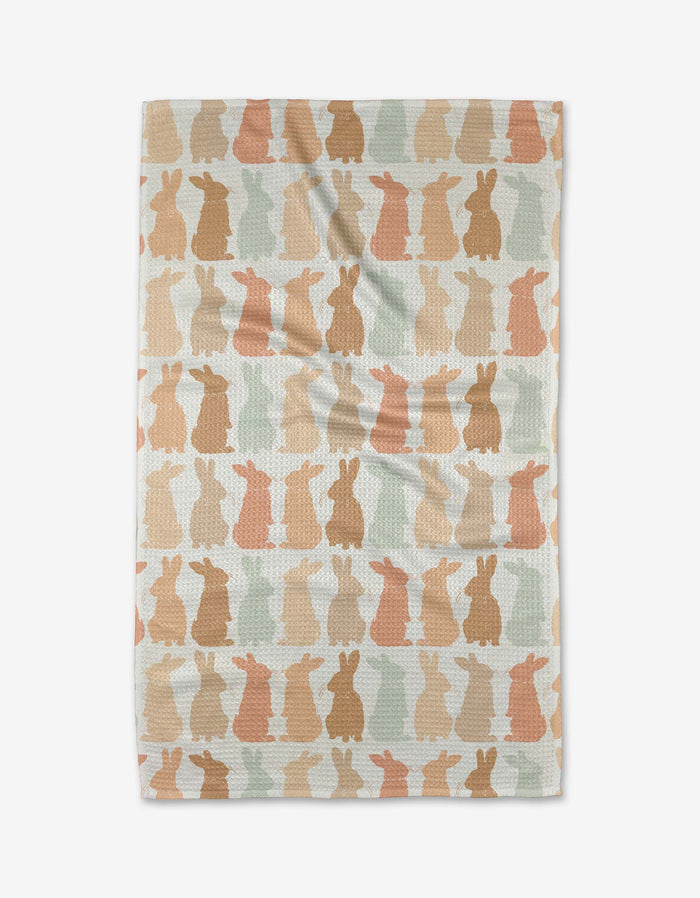 The Cute Easter Bunny tea towel by Hufton Studio is a rectangular, eco-friendly kitchen towel with rows of pastel bunny silhouettes on a light background—perfect as an absorbent and decorative dish towel.