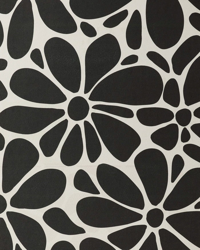 GEOMETRY’s Cute Flowers features abstract black rounded-petal blooms on a crisp white background, making this recycled yoga towel both bold and stylish.