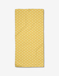 The Rebecca Bobko Daisy Daze bar towel features a yellow background with small white flowers, crafted from ultra-absorbent Geoweave fabric and displayed on a white surface.