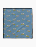 The Geometry Dalmatian In Boots Blue Paw Towel features a blue Geoweave cloth with white spotted dogs in yellow boots, arranged in rows facing both ways, and finished with black borders for a stylish touch.
