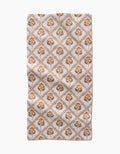 The Dancing Vines kitchen towel by Charlie Rowan Designs is a rectangular white recycled towel with a brown floral and leaf diamond pattern. Its symmetrical design brings charm and function to this ultra-absorbent kitchen essential.