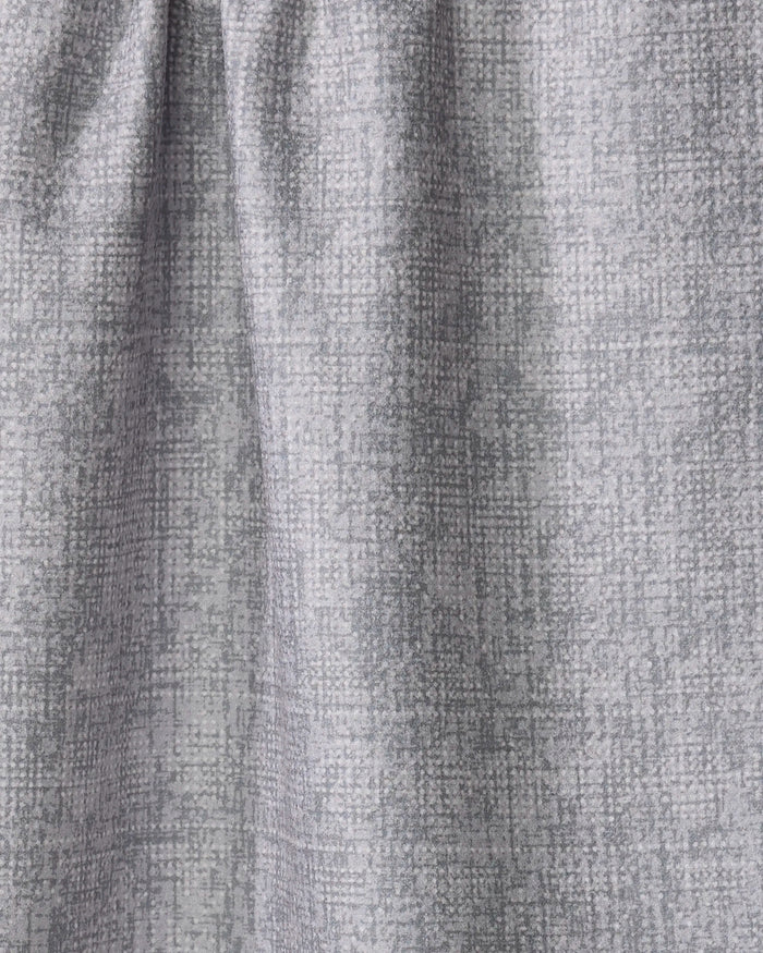 Debra Grey by Becki Owens is a light gray curtain with a subtle crosshatch pattern, made from recycled materials. Softly gathered at the top, it creates gentle folds and a slightly shaded look.