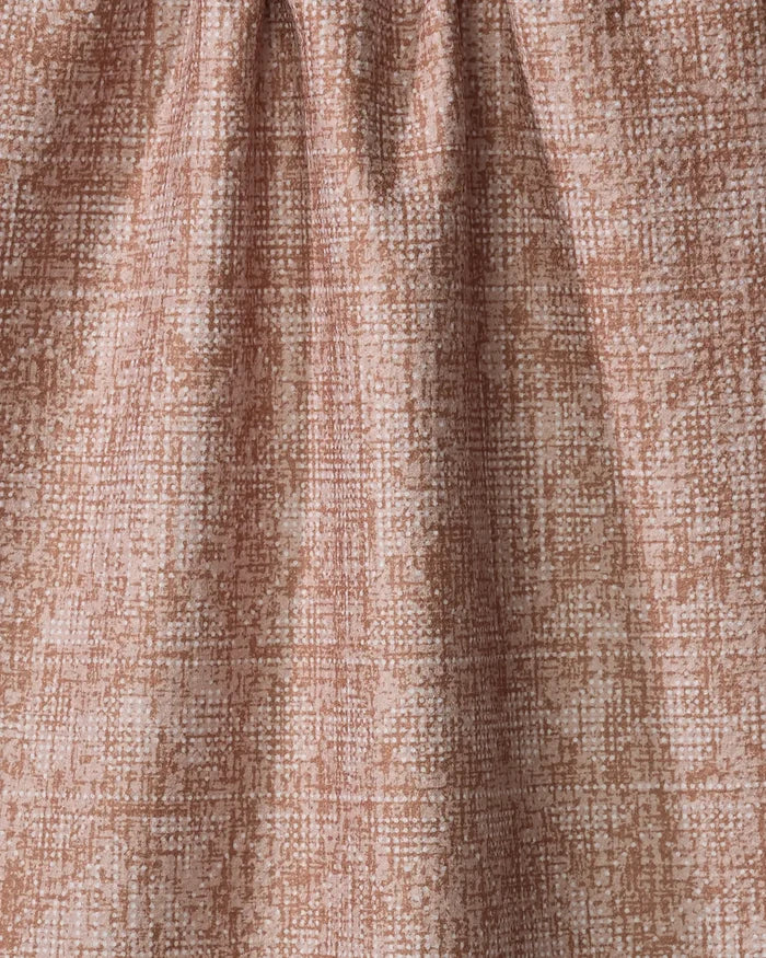 Close-up of the Becki Owens Debra Rust quick-drying towel in light brown and beige, featuring a subtle grid-like pattern and gentle folds.