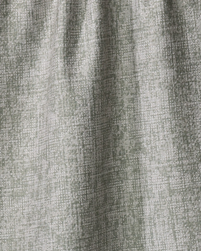 Debra Sage by Becki Owens features light gray and sage green textured fabric made from recycled materials. Its subtle abstract grid pattern and gentle drape make it a quick-drying tea towel that adds depth with soft shadows and highlights.
