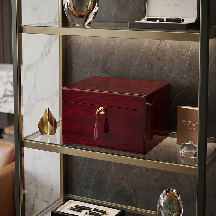 Red urn box on a marble shelf with decorative items